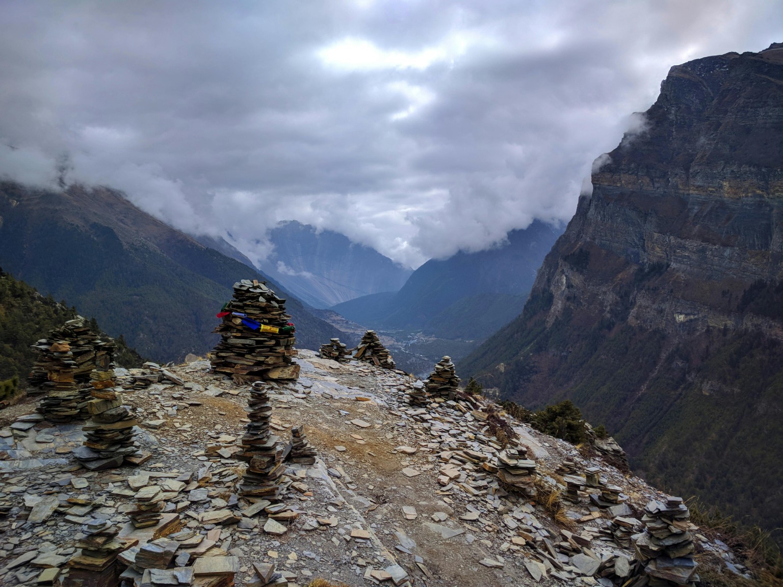 Mountain trail lined with prayer stones in Nepal